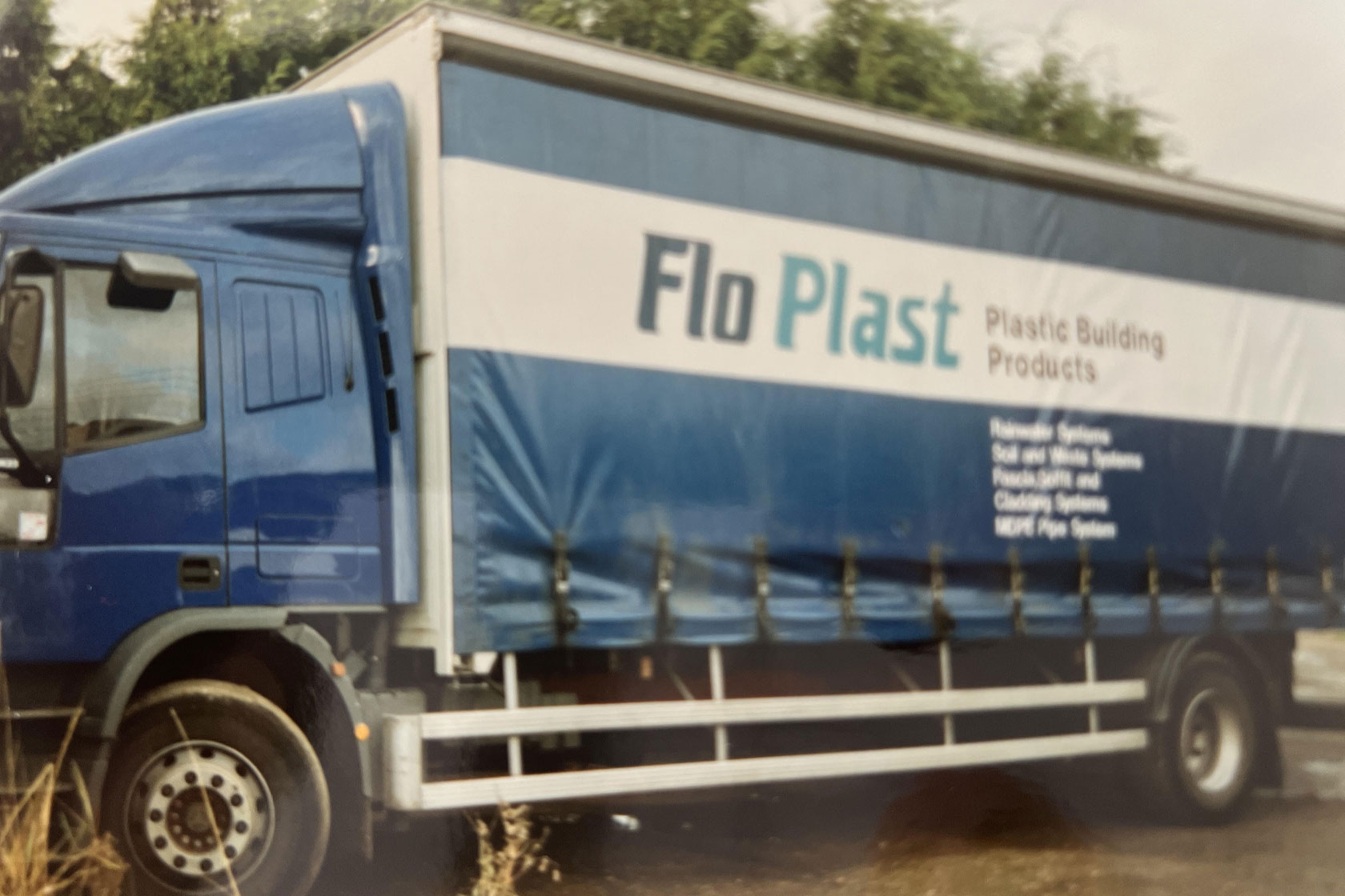 A photo of the first new Lorry to join the fleet in the form of a Blue Iveco 17 Tonne Rigid, image shows a side profile of the truck