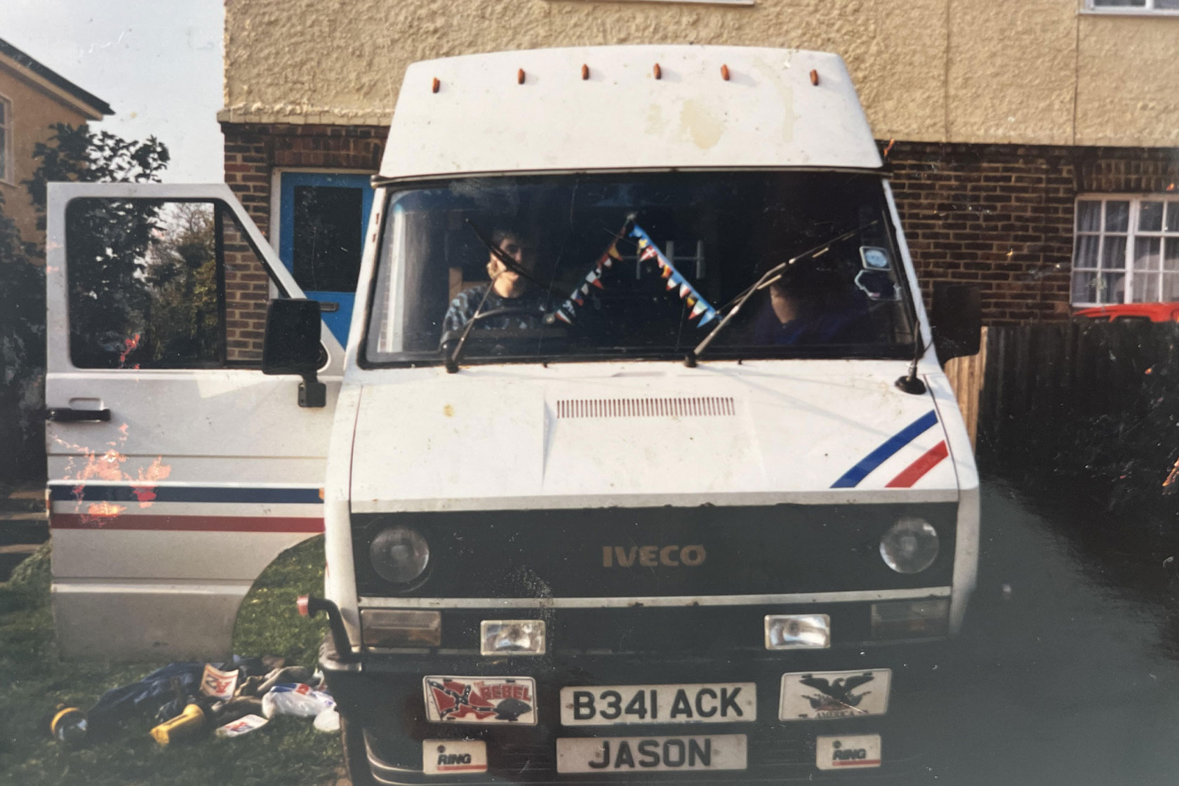 A image of Jason Whent at the age of 17 sat in a old white Iveco van in his garden.